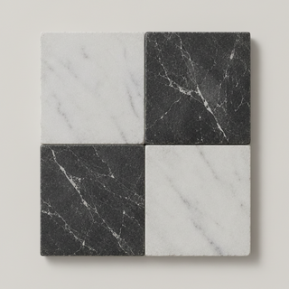 Four square stone tiles arranged in a 2x2 chequer grid, alternating between white marble and dark charcoal/black marble with natural veining