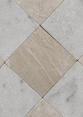 Diamond-patterned floor tiles in a mix of light beige and cool gray marble textures, arranged in a diagonal grid.