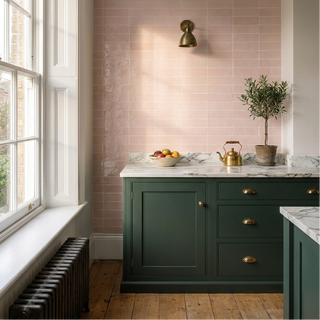 Pink brick tiles in a green kitchen