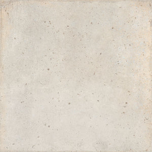 A square tile in light beige stone colour with a concrete texture with subtle speckling and a slightly distressed border.