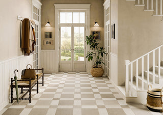 A checker floor featuring st remo tumbled porcelain in white and beige in a hallway setting